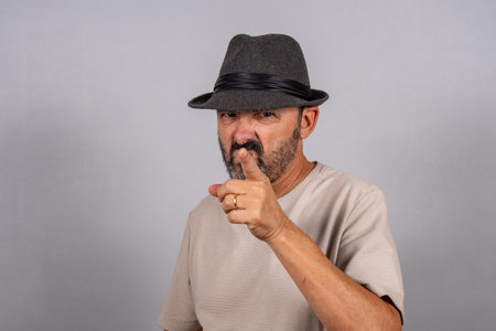 Portrait of Happy Mature Man Pointing At Camera.の写真素材