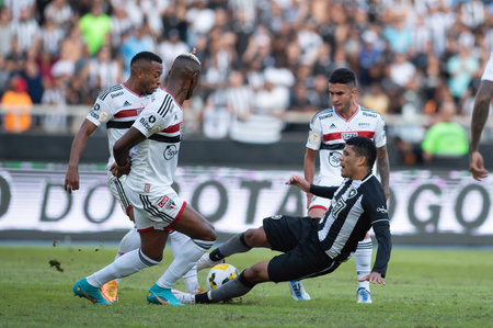 Rio, Brazil - June 16, 2022: Vinicius Lopes and Arboleda player in match between Botafogo vs Sao Paulo by 12th round of Brazilian Championship in Nilton Santos Stadiumのeditorial素材