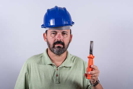 Portrait of 60 years old professional heavy industry engineer/worker wearing hardhatの写真素材