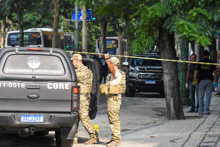 Rio, Brazil - august 03, 2022: CORE car with police beside it during attempted bank robberyの写真素材