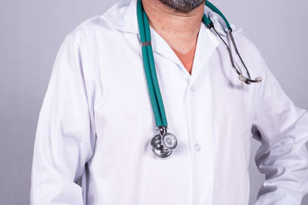Senior attractive Brazilian doctor in a white coat, on the faceの写真素材