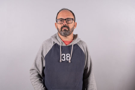 Portrait of happy senior in smart casual real clothes and in profile