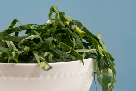 Cabbage chopped into strips in pot isolated.の写真素材