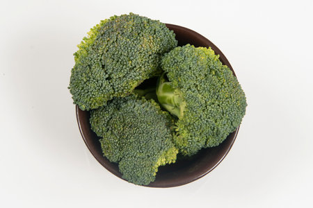 Fresh raw broccoli in pot isolated.の写真素材