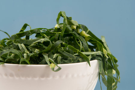 Cabbage chopped into strips in pot isolated.の写真素材