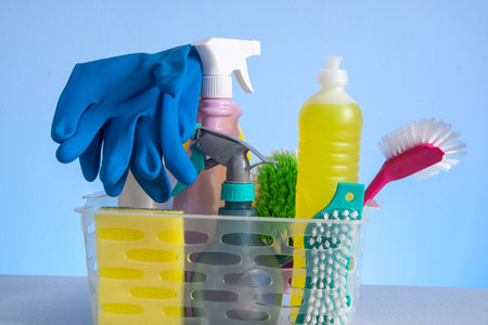 basket with cleaning products for home hygiene use with plastic packagingの写真素材