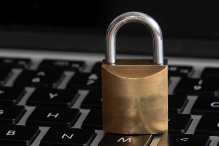 Internet and computer security represented by a closed padlock over a keyboard