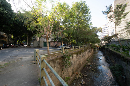 Rio, Brazil - July 05, 2022: view of the Maracana river which is partially channeled with trees around it in the Tijuca neighborhoodのeditorial素材