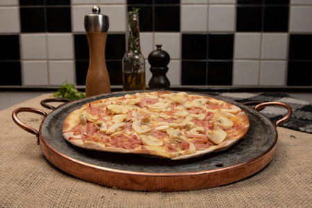 Brazilian mushroom, cheese and ham pizza, top viewの写真素材