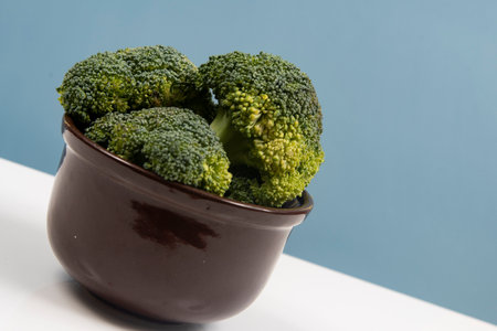 Fresh raw broccoli in pot isolated.の写真素材