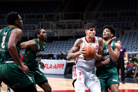 Rio, Brazil - November 29, 2022: Gabriel Jau of Flamengo battles with Paulo of Cerrado during the men's New Brazilian Basketball (NBB) at Maracanazinho Stadiumのeditorial素材