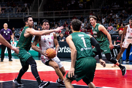 Rio, Brazil - November 29, 2022: Aguirre of Flamengo battles with Fabricio of Cerrado during the men's New Brazilian Basketball (NBB) at Maracanazinho Stadiumのeditorial素材