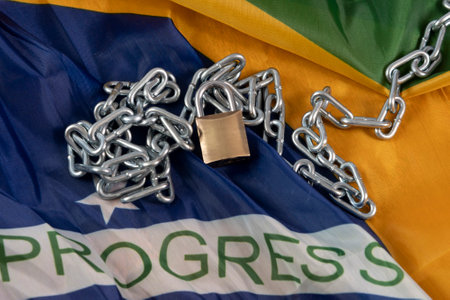 chain, padlock and Brazilian flag symbolizing slavery in the countryの写真素材