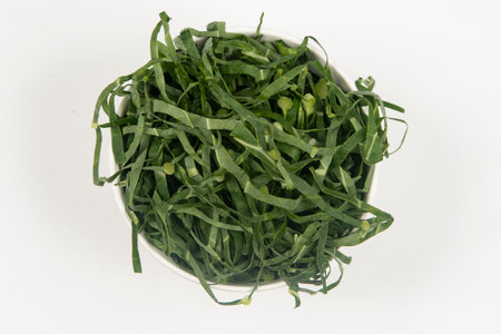 Cabbage chopped into strips in pot isolated.の写真素材