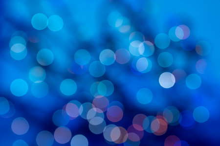 abstract defocused glowing light bulbs background, blur concept. Christmas wallpaper decorations. Festival Holiday Scenery, Glow Circle Illuminated Celebrations Display.の写真素材