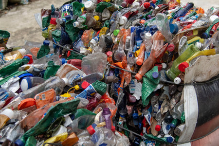 Rio, Brazil - November 26, 2022: recyclable garbage pressing into big balesのeditorial素材