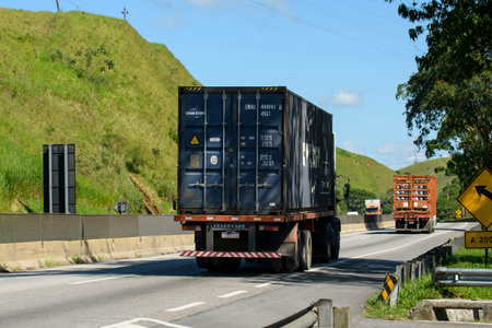 Rio, Brazil - october 17, 2023 - cargo truck with container used on a ship on a road in Brazil -...