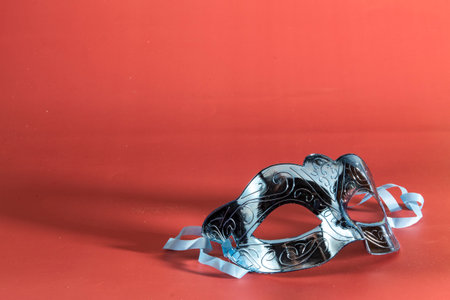 carnival mask forming frame in one of the lower corners with space for textの写真素材