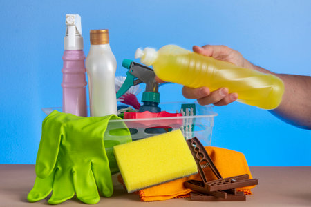 basket with cleaning products for home hygiene use with plastic packagingの写真素材