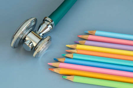 palette of colored pencils and a stethoscope representing the pediatrician doctorの写真素材