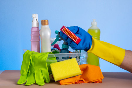 basket with cleaning products for home hygiene use with plastic packagingの写真素材