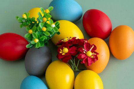 Colorful easter eggs with flowers on green background. happy easterの写真素材
