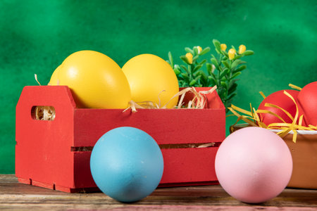eggs in wooden box with hay on rustic background or surface, easter or holiday concept, low angle viewの写真素材