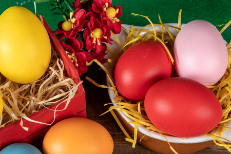 eggs in wooden box with hay on rustic background or surface, easter or holiday concept, high angle viewの写真素材