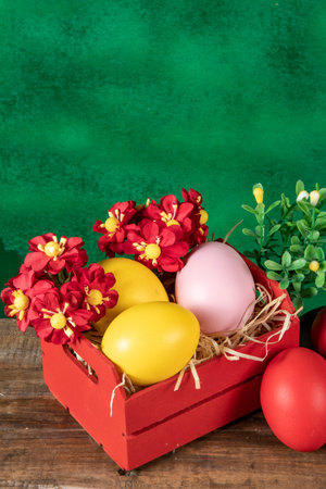 eggs in wooden box with hay on rustic background or surface, easter or holiday concept, high angle viewの写真素材