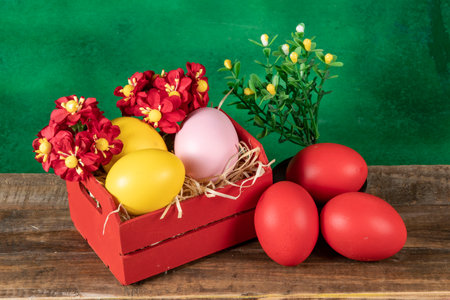eggs in wooden box with hay on rustic background or surface, easter or holiday concept, high angle viewの写真素材