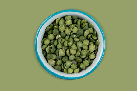 green peas in halves in bowl isolated on background. Topview. Flat lay and clipping pathの写真素材