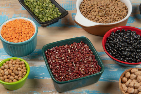 assorted bowls with raw grain and seeds viewed from aboveの写真素材