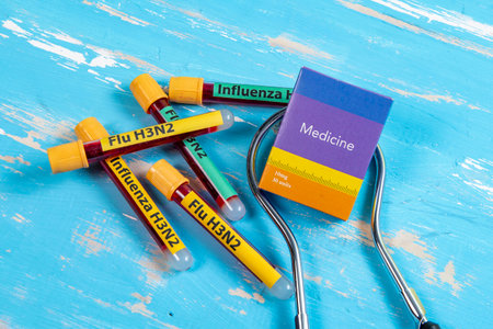 vacuum vials for blood collection written FLU H3N2 in reference to the flu typeの写真素材