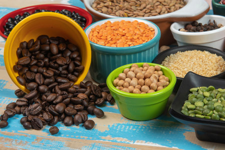 assorted bowls with raw grain and seeds viewed from aboveの写真素材