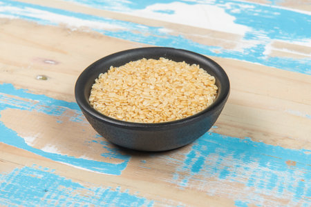 bowl with Sesame on blue rustic wooden table, up viewの写真素材