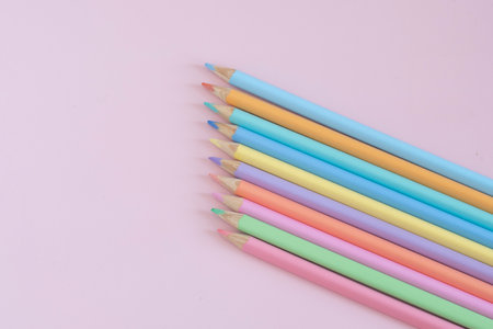 Pastel colored pencils, top view on pink background, illustration concept, background and education and back to schoolの写真素材