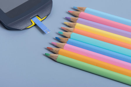 Back to school concept for kids with diabetes represented by colored pencils and glucometerの写真素材