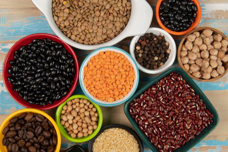 assorted bowls with raw grain and seeds viewed from aboveの写真素材