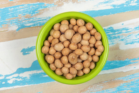 bowl with soy beans on blue rustic wooden table, Top viewの写真素材