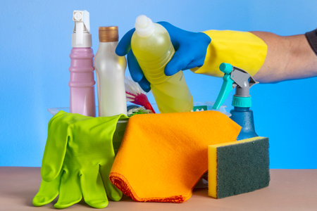 basket with cleaning products for home hygiene use with plastic packagingの写真素材