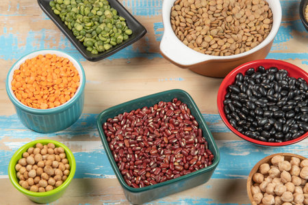 assorted bowls with raw grain and seeds viewed from aboveの写真素材