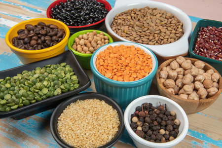 assorted bowls with raw grain and seeds viewed from aboveの写真素材