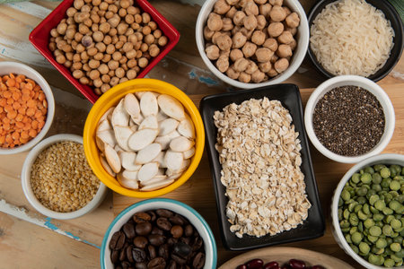 Soybean, lentils, chickpea, soybeans, beans and legumes in bowlsの写真素材