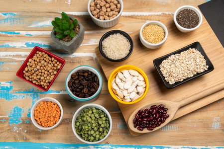 Soybean, lentils, chickpeas, soybeans, beans and cereals in bowlsの写真素材