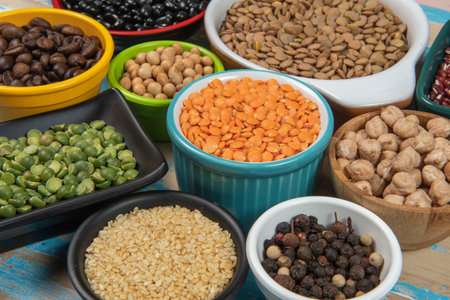 assorted bowls with raw grain and seeds viewed from aboveの写真素材