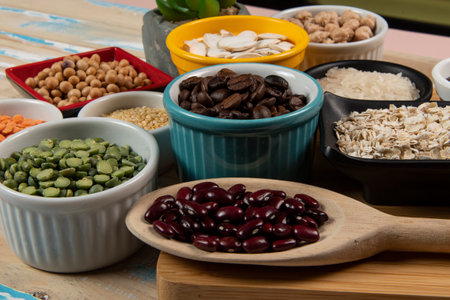 Different types of vegetables in bowls, green and yellow peas, chickpeas, colored beans and lentils, beans, top viewの写真素材