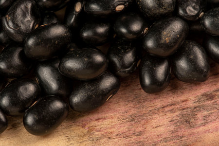 heap of black beans scattered detail, top viewの写真素材