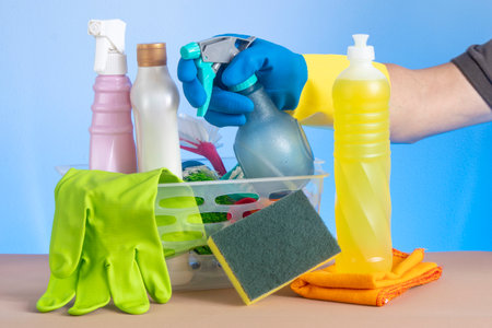 basket with cleaning products for home hygiene use with plastic packagingの写真素材