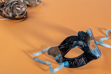 Venetian carnival mask forming frame in one of the lower corners with space for textの写真素材