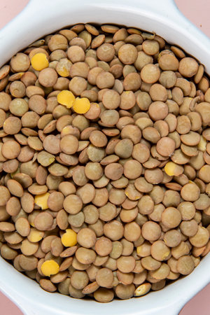 Lentils in bowl isolated with background. Top view and Flat layの写真素材